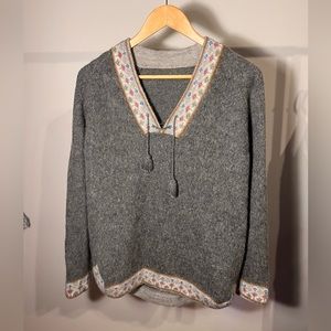 Nordic lace up sweater with colourful detailing